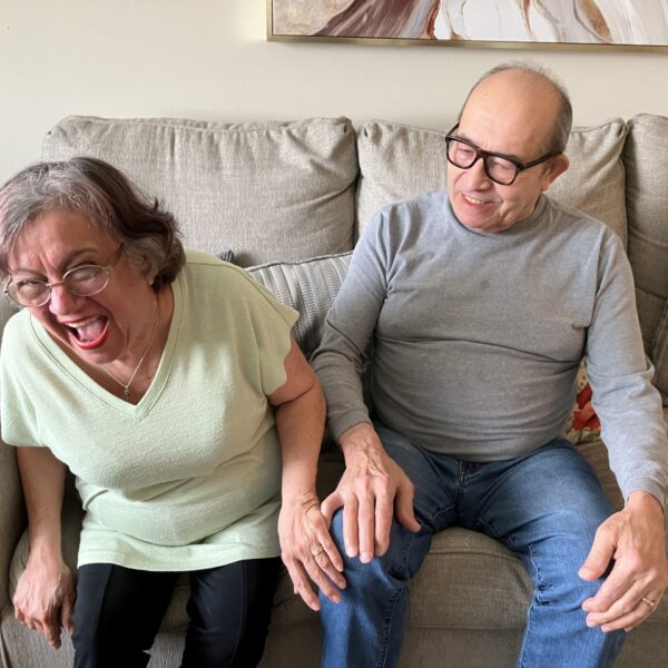 Raúl and Luisa laughing together at home