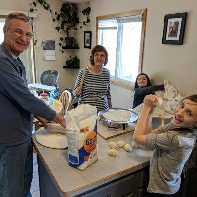 Tabatha's parents teaching her daughters to make lefse.